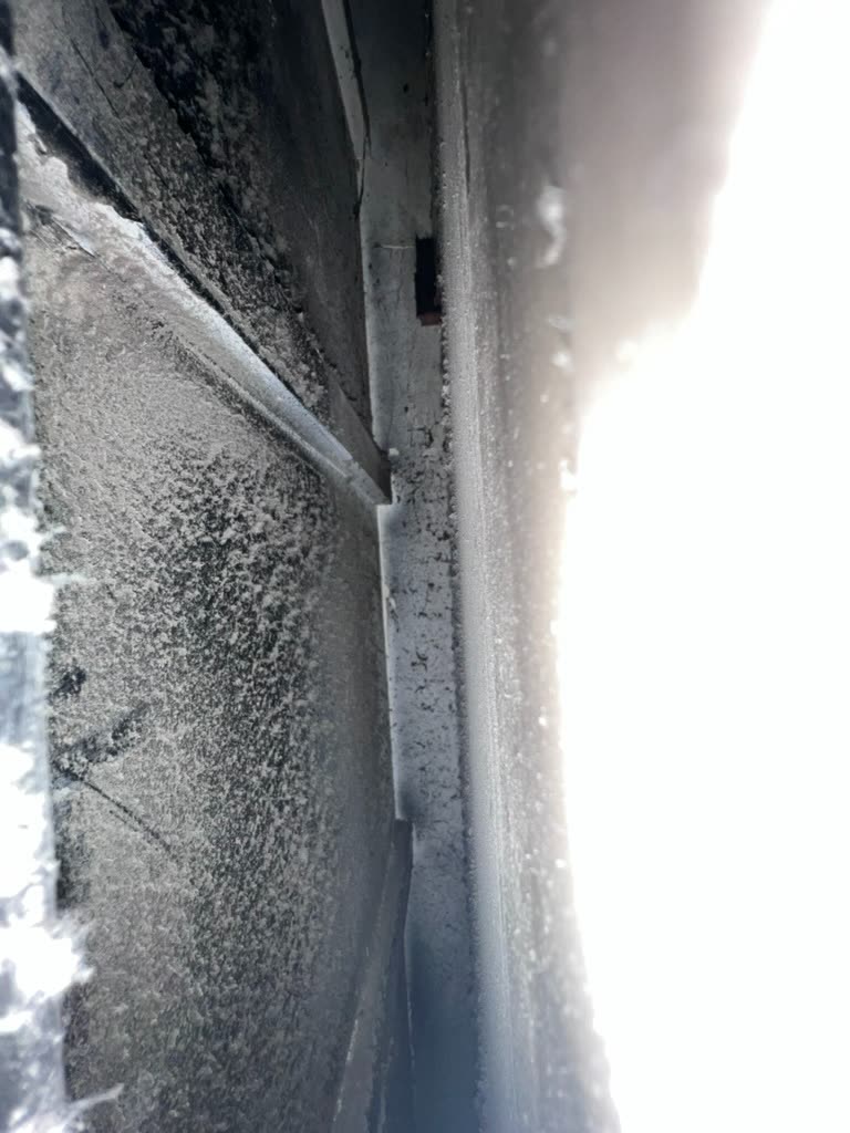 Heavy dust accumulation and dark mold staining along HVAC plenum seam in Coral Gables, Florida home