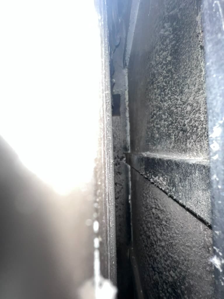 Interior duct view showing dust buildup and dark mold growth along HVAC seam