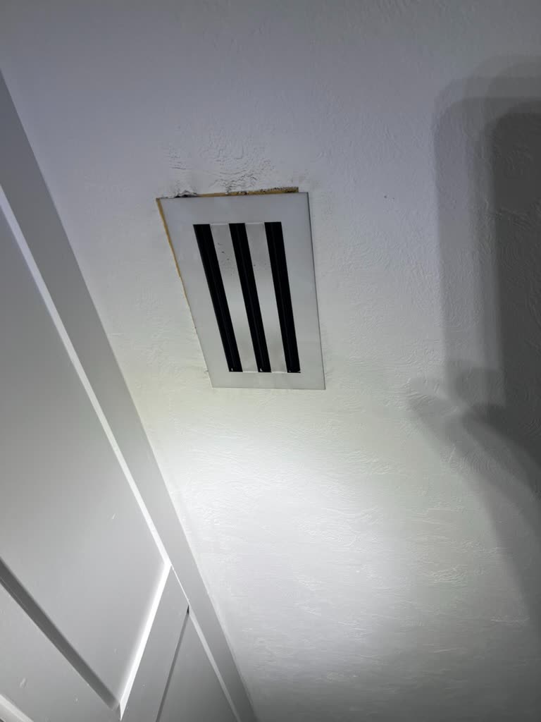 Ceiling drywall staining around HVAC supply vent diffuser in Coral Gables, Florida home