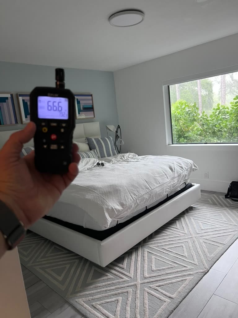 Thermo-hygrometer reading 66.6 degrees and 79.2 percent relative humidity in master bedroom
