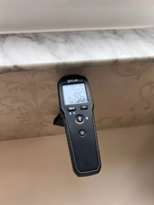 Moisture meter reading 96 percent relative humidity beneath a marble windowsill in Fort Lauderdale, FL