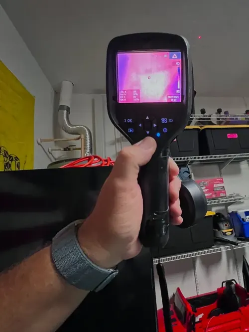 Thermal imaging camera scanning an attic ceiling for moisture anomalies in Margate, FL