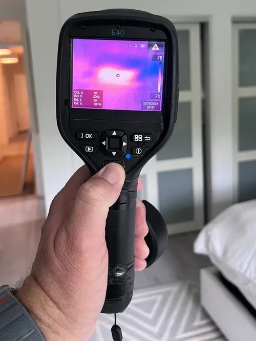 Thermal imaging camera detecting a moisture anomaly on a bedroom wall in Coral Springs, FL
