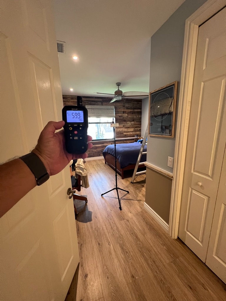 FLIR moisture meter reading 59.9 percent relative humidity and 78.6 degrees Fahrenheit in a hallway area near a bedroom