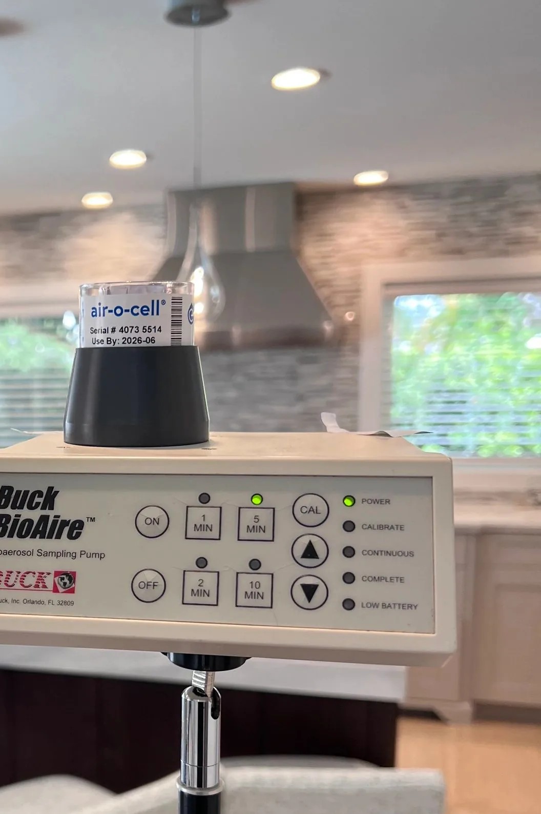 Air-O-Cell sampling cassette mounted on a Buck BioAire bioaerosol sampling pump during a Sigma indoor air sample collection