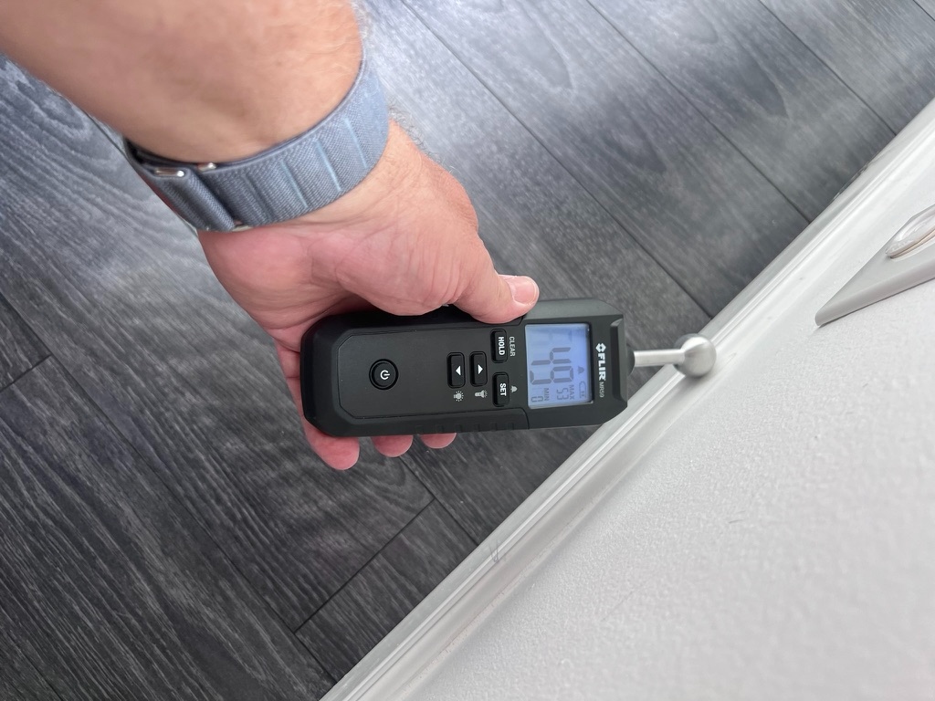 Moisture meter reading from a master bathroom plumbing leak case study in Miramar