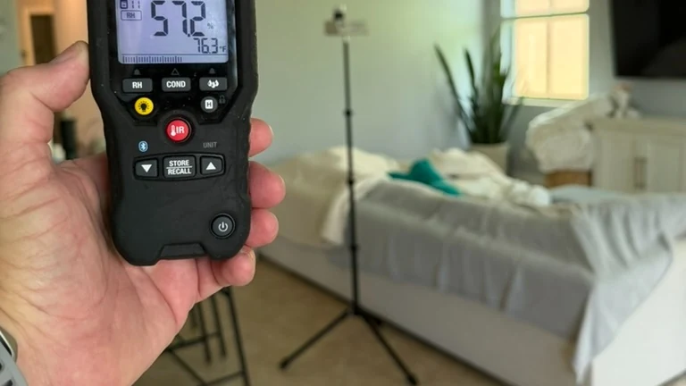 Indoor air sampling pump on a tripod during a residential mold inspection